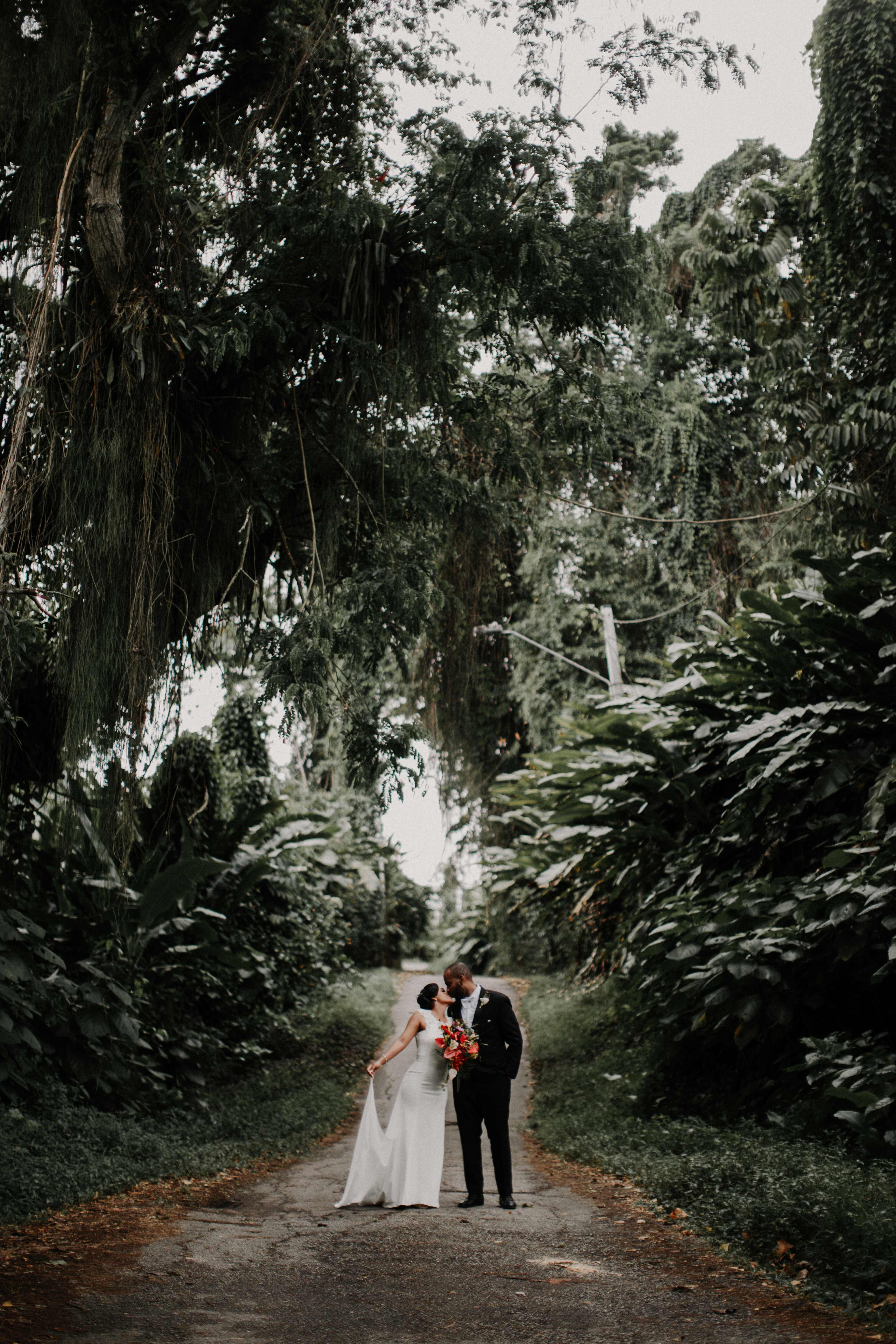 Sarah and Marcus, happy newlyweds kissing in San Salvador Estate!